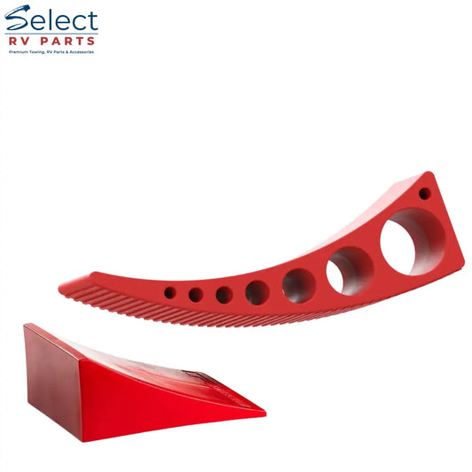 Red plastic tool with multiple holes and a textured surface on a white background